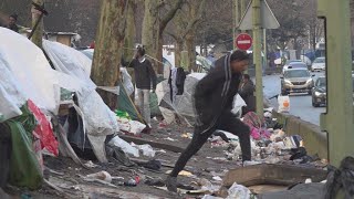 Thousands of asylum seekers waiting in streets makeshift camps around Paris [upl. by Bethezel330]